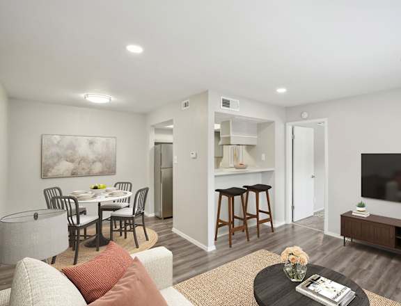 a living room with a couch and a table with chairs at The Keller, Texas