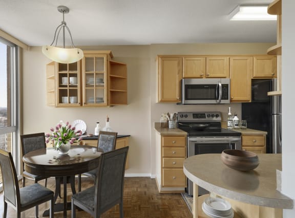 a kitchen and dining area in a 555 waverly unit at The Edina Towers, Minnesota