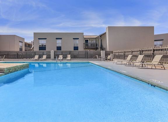 our apartments have a large pool and lounge chairs