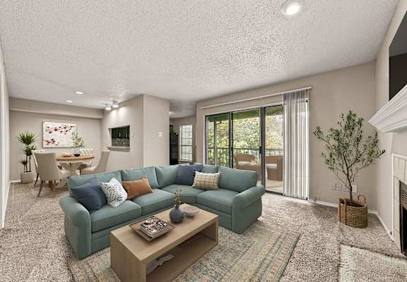 a living room with a blue couch and a coffee table