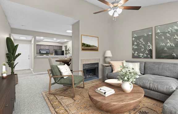an open living room with a fireplace and a ceiling fan