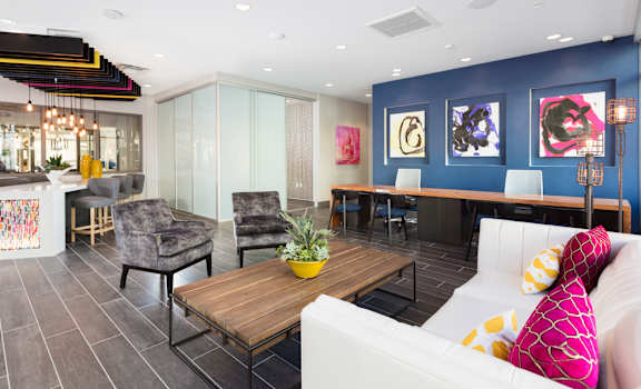 a living room filled with furniture and a large window