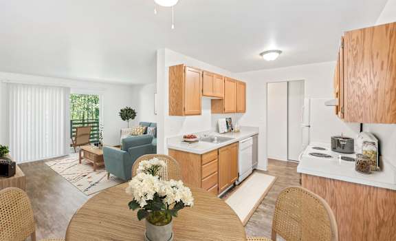 a kitchen and dining room with a table and chairs at Whisperwood, Seattle