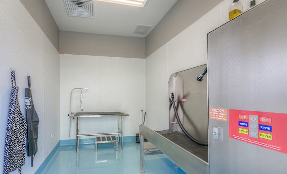 a room with a pool and a shower and a table in it  at Waterside Residences on Quivira, Kansas
