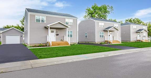 A row of houses with a driveway in front at Poplar Place Apartments, Springfield, Illinois