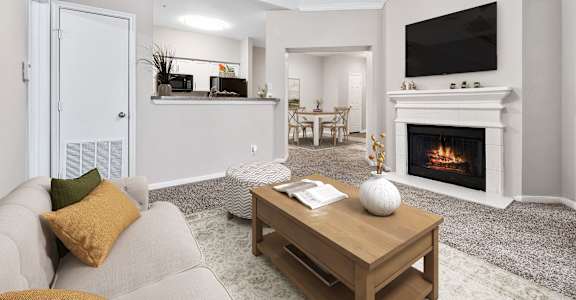 a living room with a fireplace and a couch