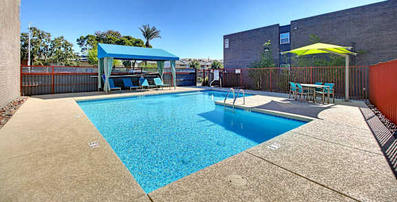 our apartments have a large pool and lounge chairs
