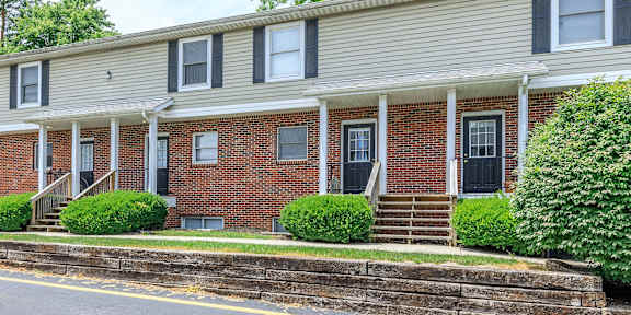 A brick building with the number 305 on it.