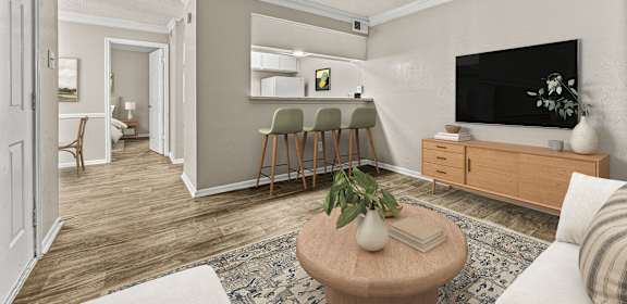 a living room with a couch and a table with chairs  at 5636 Apartment Homes, Texas, 75254