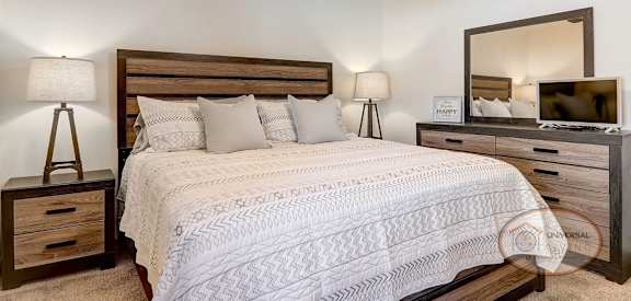 a bedroom with a bed and a ceiling fan