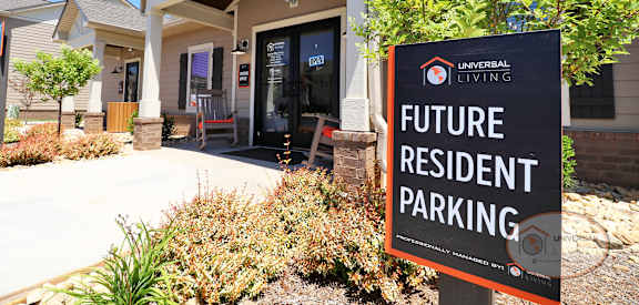 a sign in front of a building that says future resident parking