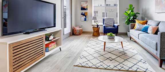 a living room with a couch and a tv