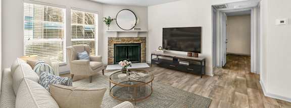 a living room with a fireplace and a tv  at Vesper, Dallas, Texas