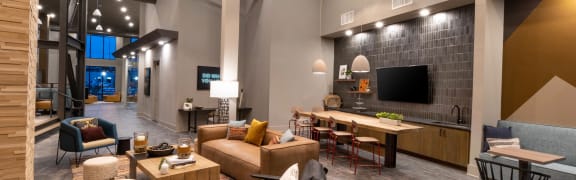 a living room with couches and chairs and a tv