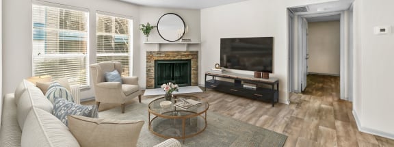 a living room with a fireplace and a tv  at Vesper, Dallas, Texas