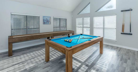 a game room with a pool table and a billiards