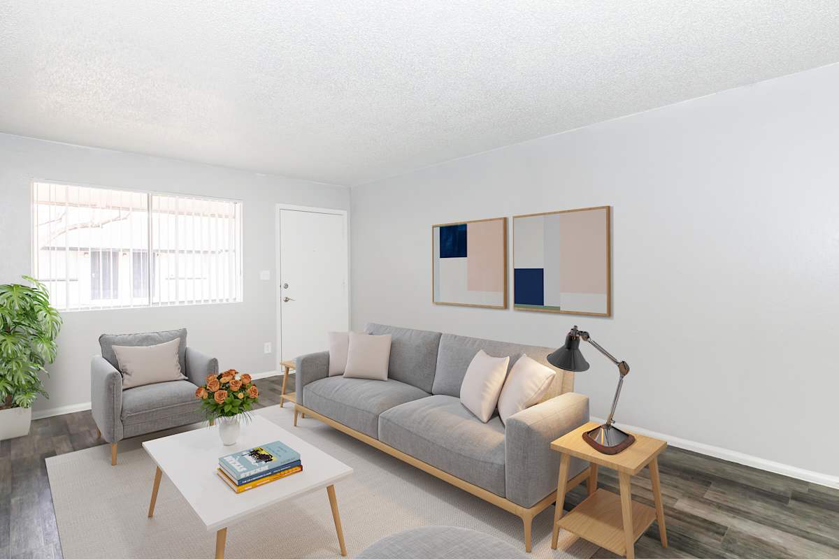 Furnished apartment living area shown at The Cara Apartments.