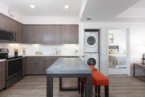 Oakland, CA Apartments- 777 Broadway - Wood-Style Floors, Stainless-Steel Appliances, and Kitchen Island