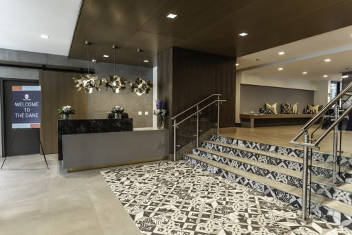 Gorgeous hotel-style apartment entrance with patterned tile flooring