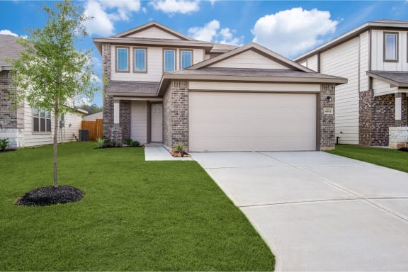 a house with a driveway in front of it
