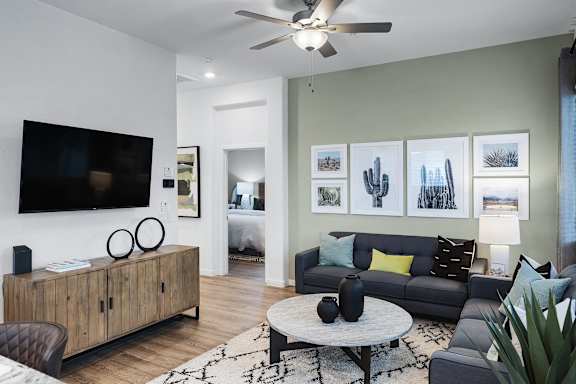 a living room with a couch and a tv
