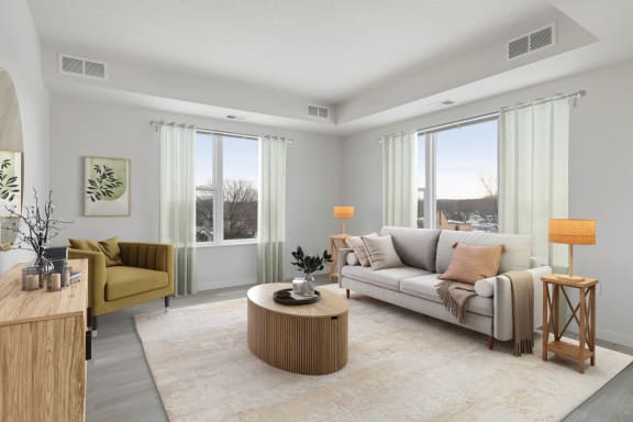the living room of an apartment with a couch and a table