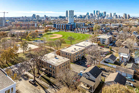 A cityscape with a mix of residential and commercial buildings.