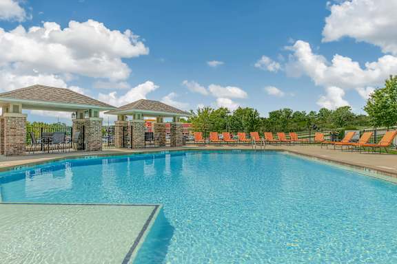 the swimming pool at the estates apartments