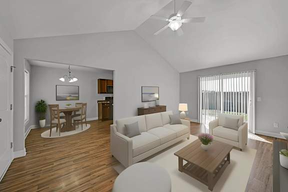 A living room with a white couch, a wooden coffee table, and a ceiling fan.