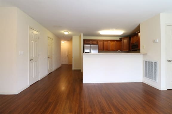 a kitchen with stainless steel appliances and wooden cabinets