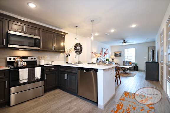 a kitchen with stainless steel appliances and wooden cabinets