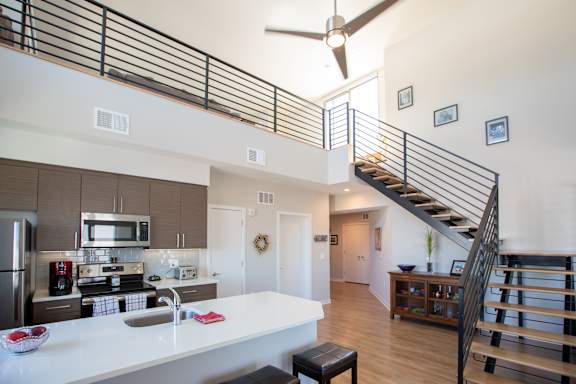 a living room and dining room with a couch and a table