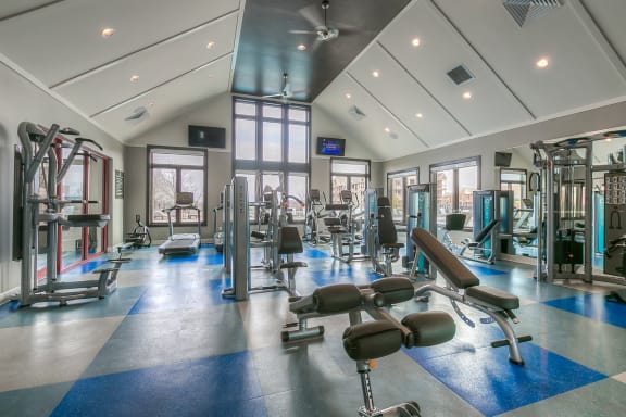Lenexa Apartments for Rent-Waterside Residences at Quivira Apartments Spacious Gym With Updated Machines And Views Of Property  at Waterside Residences on Quivira, Kansas