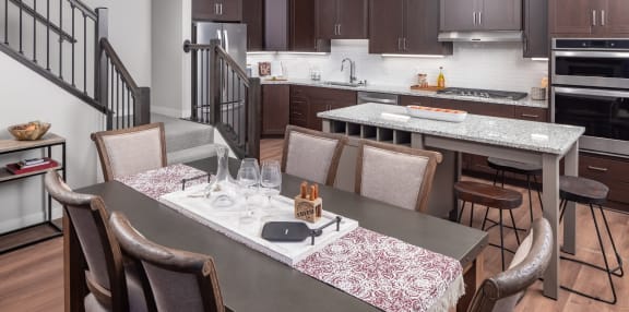 a kitchen and dining area with a table and chairs at Expo, Minneapolis Minnesota