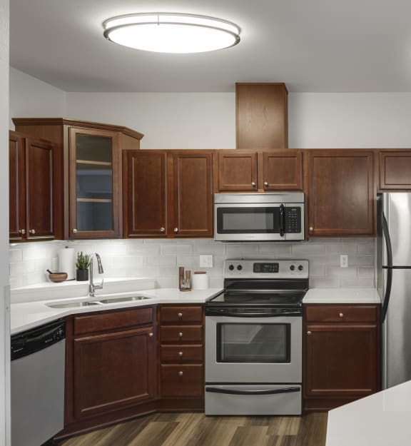 Kitchen with island and appliances at The Gables at Park Pointe, St. Louis Park, MN, 55426