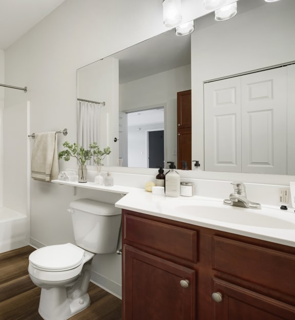 a bathroom with a toilet and a sink at The Gables at Park Pointe, St. Louis Park, MN, 55426