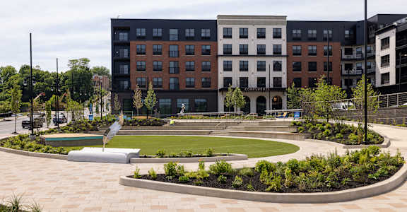 A large building with a courtyard in front of it.