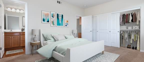 a bedroom with white walls and carpet