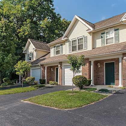 a house with a driveway and a white garage door