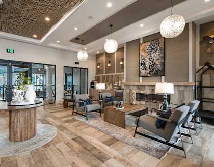 A modern living room with a wooden floor and furniture.