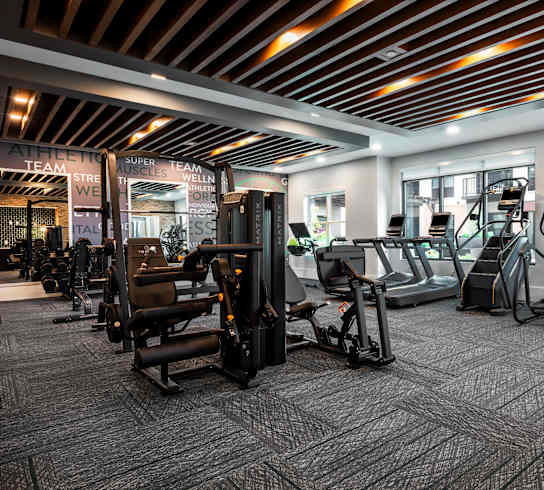 Large modern fitness center with cardio equipment and strength training machines  at Chapter at the Streets of St Charles, Saint Charles, MO, 63303