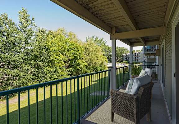 the views of the yard from the balcony of a home