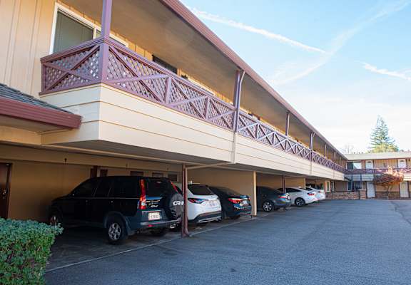 A parking garage with cars parked in it.