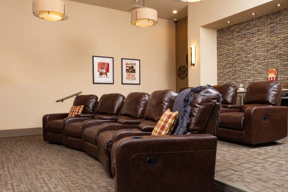 a living room filled with furniture and a large window