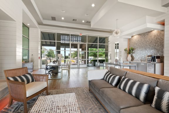 a living room filled with furniture and a large window