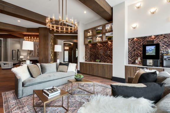 a living room filled with furniture and a large chandelier