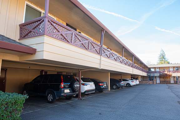 A parking garage with cars parked in it.