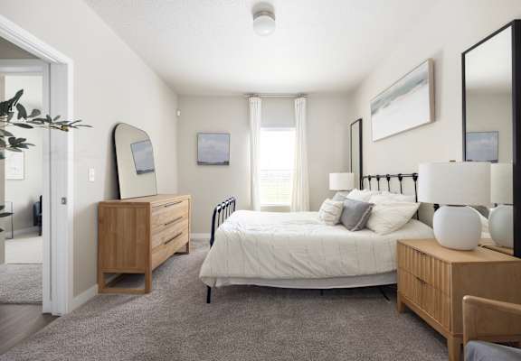 a bedroom with a bed and dresser at The Alloy at Geneva, Vineyard, 84058