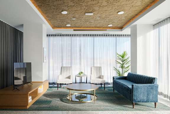 a living room with a blue couch and a coffee table