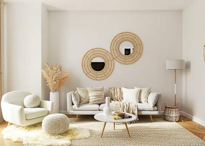 a living room with a couch and mirrors on the wall